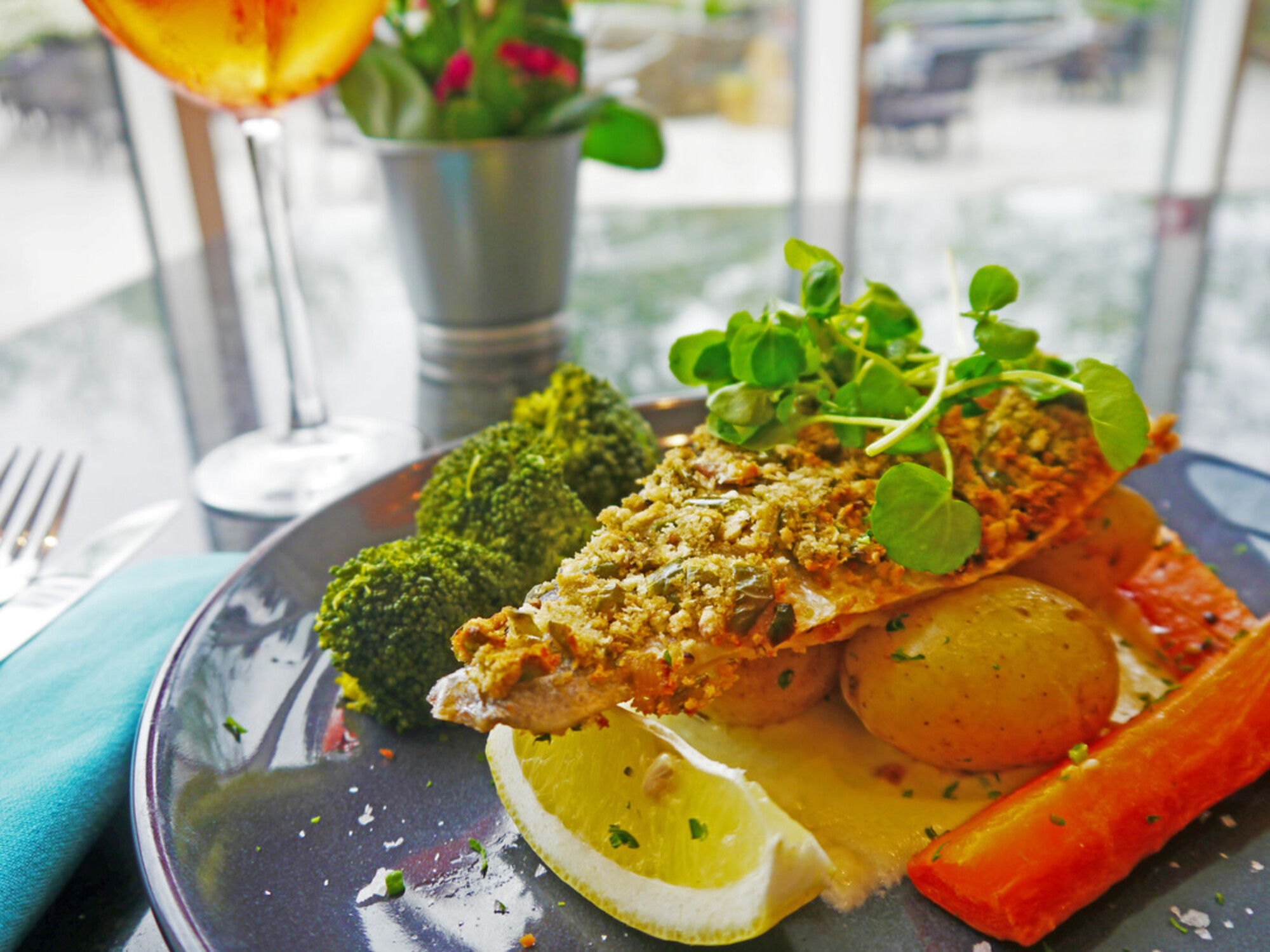 Evening Menu - Harbourside: Baked sea bass; topped with red pepper and red onion bread crumb served with seasonal vegetables, new baby potatoes and white wine butter sauce £15