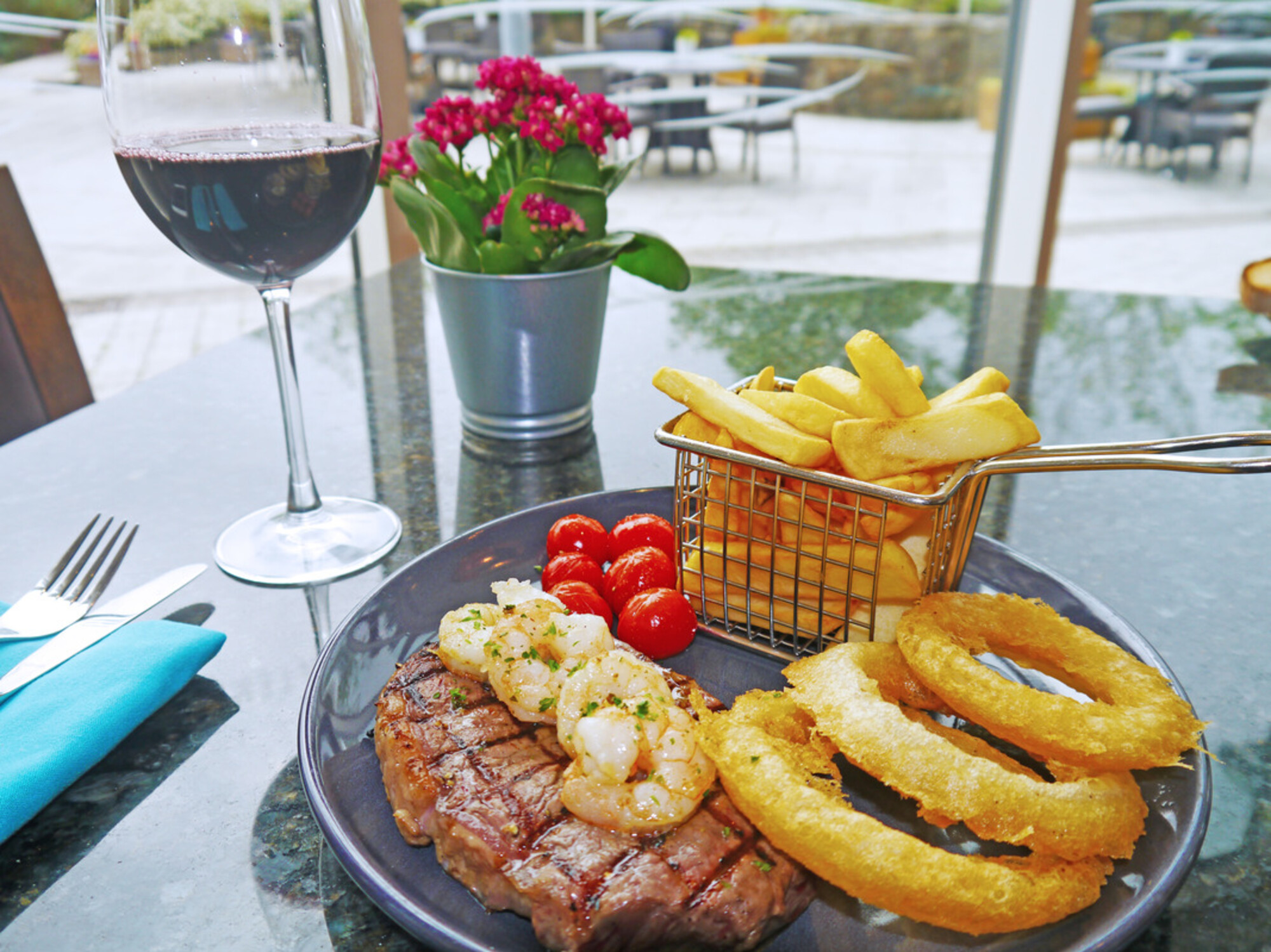 Lunch and Evening Menu: 8oz rump steak; locally sourced in Devon. Our steaks are served with cherry tomatoes, onion rings and chunky chips £14 Add on garlic king prawns £4