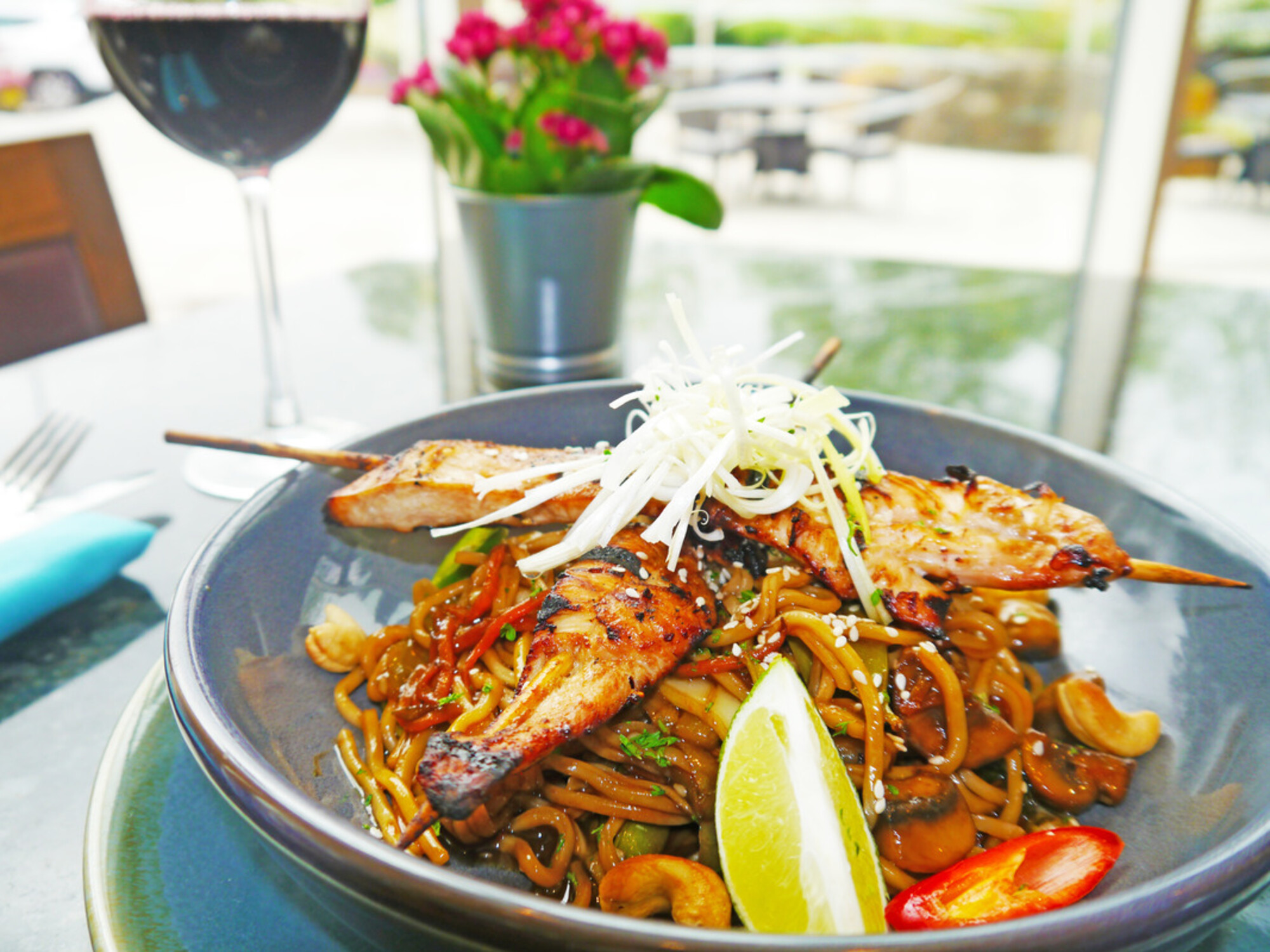 Evening Menu: Stir-fried Thai noodles; with vegetables in a Thai sauce with sesame oil, garlic, ginger, fresh lime, soy sauce and red chilli £9 Add chargrilled chicken for £4 or garlic king prawns for £4