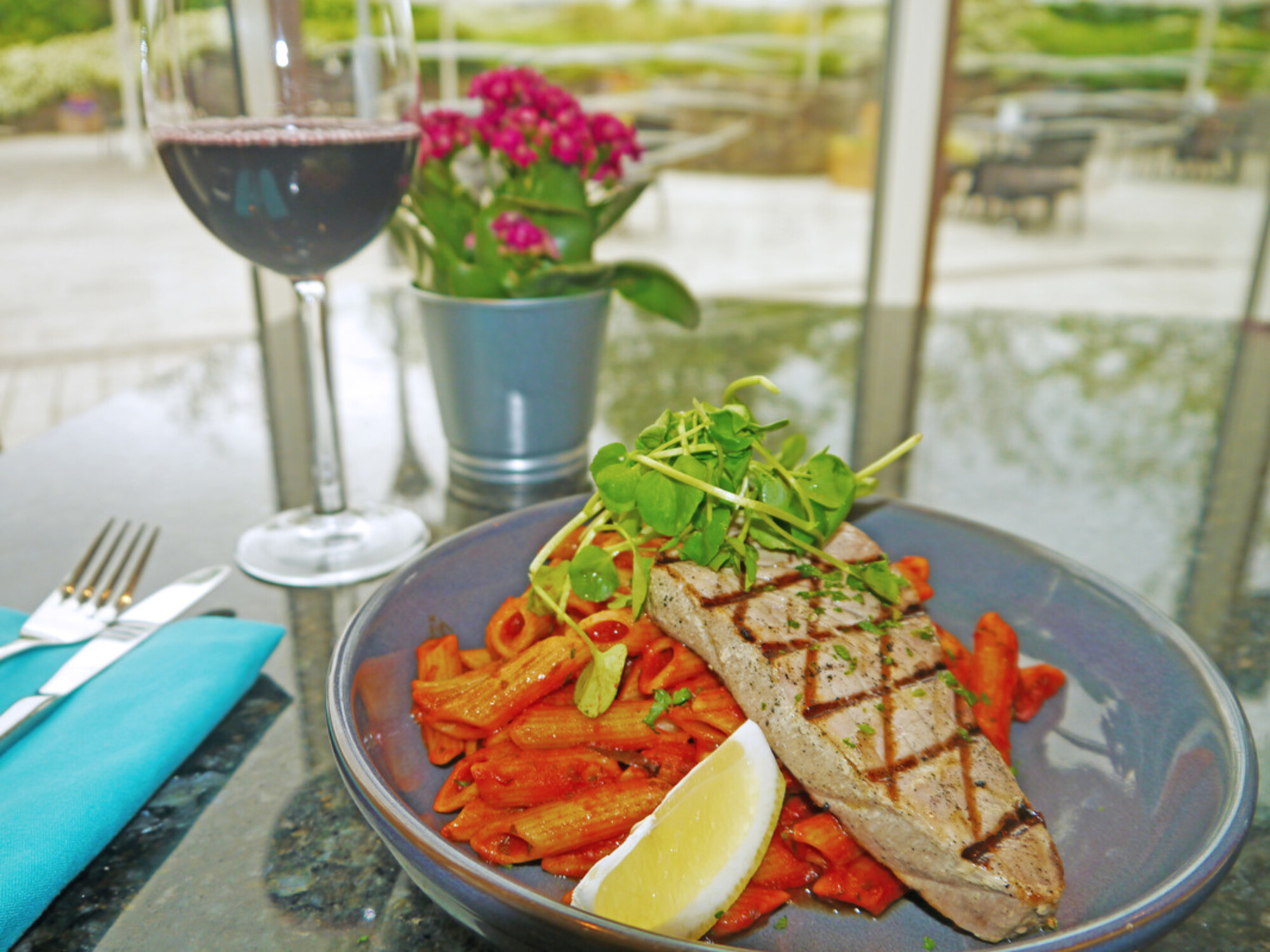 Evening Menu - Harbourside: Tuna steak; chargrilled and served on penne pasta tossed in a rich tomato sauce with olive oil, garlic and fresh herb